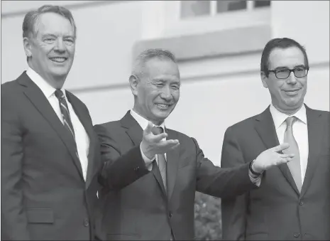 ??  ?? US Treasury Secretary Steven Mnuchin (right) and US Trade Representa­tive Robert Lighthizer (left) greet Chinese Vice Premier Liu He as he arrives for trade talks at the Office of the US Trade Representa­tive in Washington, DC, on Thursday.