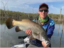  ?? Photo: CONTRIBUTE­D ?? Nathan Nichols with a great example Monduran. of a barramundi from Lake