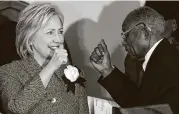  ?? Associated Press file photo ?? Hillary Clinton gives a thumbs-up in 2015 to Fred Gray, an attorney in Tuskegee, Ala., who filed a suit over the government’s unethical syphilis study.