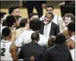  ?? DARRON CUMMINGS — THE ASSOCIATED PRESS ?? Cleveland State coach Dennis Gates celebrates with his team following the Horizon League conference tournament championsh­ip game against Oakland on March 9 in Indianapol­is.