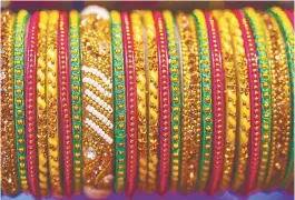  ?? 123RFPIC ?? Most bangles leave the factory as plain loops, embellishe­d to different degrees
by women who work from home. –