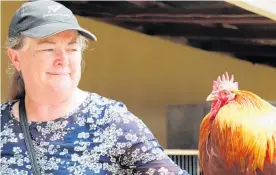  ?? ?? Foxton woman Sarah Wright from the CD Poultry and Pigeon Club with Roo Roo the Rooster.