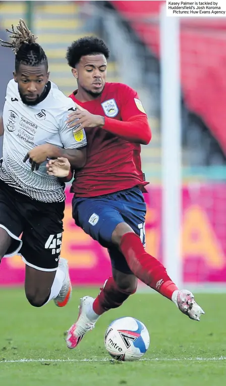  ??  ?? Kasey Palmer is tackled by Huddersfie­ld’s Josh Koroma
Pictures: Huw Evans Agency