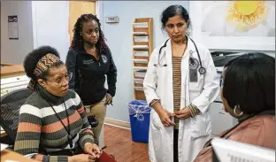  ?? ALYSSA SCHUKAR / THE NEW YORK TIMES ?? Doctors and medical assistants meet at the Jesse Brown VA Medical Center in Chicago where the vast majority of doctors and staff are women and the five exam rooms and waiting area are for women only. This year, the House Veterans Affairs Committee will establish a task force to address women’s health care, and harassment issues are expected to be front and center.