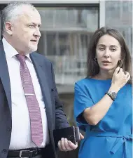  ?? AP ?? Russian National Anti-doping Agency (RUSADA) head Yuri Ganus (left) and Margarita Pakhnotska­ya, deputy CEO of RUSADA, leave their office to talk to journalist­s in Moscow, Russia, yesterday.