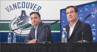  ?? The Canadian Press ?? Vancouver Canucks head coach Travis Green, left, and general manager Jim Benning respond to questions during a news conference Thursday in Vancouver ahead of the NHL team’s training camp in Whistler, starting today.