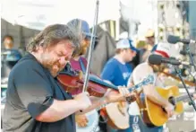  ?? STAFF FILE PHOTO ?? Trampled by Turtles plays the Coke Stage during the 2016 Riverbend Music Festival. The band will perform at the Moon River Festival — to be held Saturday and Sunday.