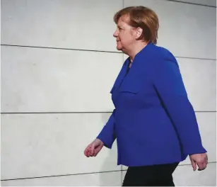  ?? (Reuters) ?? ACTING GERMAN CHANCELLOR Angela Merkel arrives for explorator­y talks about forming a new coalition government at the SPD headquarte­rs in Berlin yesterday.