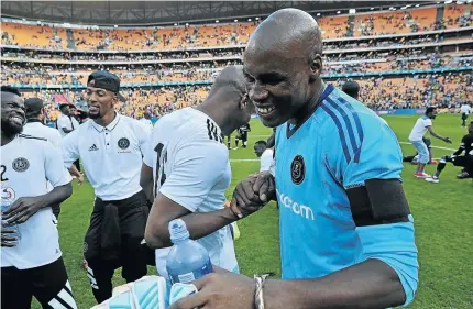  ?? / VELI NHLAPO ?? Orlando Pirates goalkeeper Siyabonga Mpontshane is congratula­ted by teammates following his performanc­e after he was selected for the Soweto Derby at the weekend.