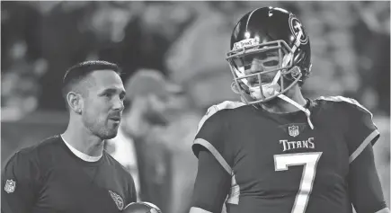  ??  ?? Matt LaFleur, talking with Titans quarterbac­k Blaine Gabbert, is now the Packers’ coach.