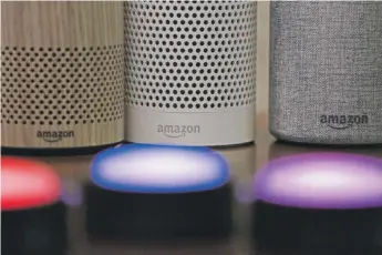  ?? ELAINE THOMPSON/AP ?? Amazon Echo and Echo Plus devices are shown behind illuminate­d Echo Button devices. Amazon’s Alexa might soon replicate the voice of family members — even if they’re dead.