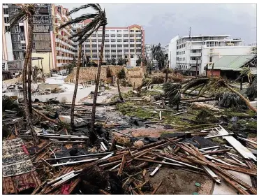  ?? JONATHAN FALWELL / AP ?? Debris is strewn about St. Martin on Wednesday after Hurricane Martin struck. “Everything is a disaster, total devastatio­n,” said resident Dieter Schaede. “Roofs down, houses totally flown away, wiped out.”