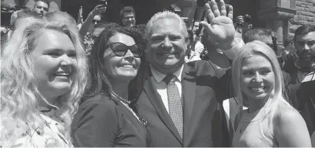  ?? CRAIG ROBERTSON ?? Doug Ford, joined by members of his family, greets onlookers at Queen’s Park on Friday, when he was sworn in as Ontario’s new premier. In choosing his cabinet, Ford has put most of the province’s most powerful ministries in the hands of veteran MPPs, writes David Reevely.