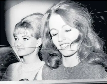  ??  ?? > Christine Keeler, right, and Mandy Rice-Davies leaving the Old Bailey after the first day of the trial of Dr Stephen Ward, the 50-year-old osteopath who faced vice charges, in 1963