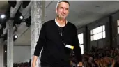  ??  ?? In this file photo taken on June 21, 2018 Belgian designer Dries Van Noten acknowledg­es the audience at the end of his men’s Spring/Summer 2019 collection fashion show in Paris.