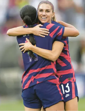  ?? AP FILE ?? U.S. veteran forward Alex Morgan (13) has taken on a leadership role with younger teammates like Sophia Smith.