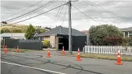  ?? STUFF ?? Road cones around the Tribesmen gang headquarte­rs in Woolston yesterday.