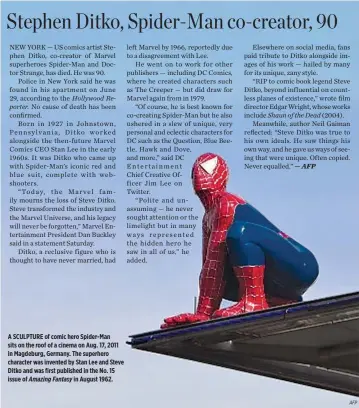  ??  ?? A SCULPTURE of comic hero Spider-Man sits on the roof of a cinema on Aug. 17, 2011 in Magdeburg, Germany. The superhero character was invented by Stan Lee and Steve Ditko and was first published in the No. 15 issue of Amazing Fantasy in August 1962.