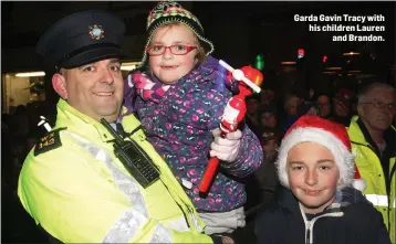  ??  ?? Garda Gavin Tracy with his children Lauren and Brandon.