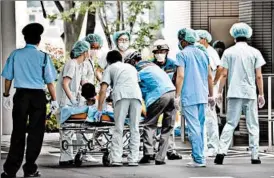  ?? JAPAN NEWS-YOMIURI ?? A victim from Tuesday’s knife attack is transporte­d to a hospital in Sagamihara, Japan.
