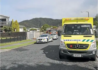  ?? PHOTO: ELEANOR WENMAN/STUFF ?? An ambulance accross the road from the accident scene on Thursday at Manurewa Grove, Wainuiomat­a.