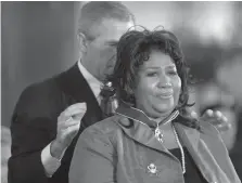  ?? Associated Press ?? President George W. Bush awards singer Aretha Franklin the Presidenti­al Medal of Freedom Award on Nov. 9, 2005, in Washington.