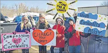  ?? – Kirk Starratt, www.kingscount­ynews.ca ?? Twelve-year-old Cassie Barkhouse of Brooklyn, Hants County, 12-year-old Mackie Oickle of Windsor, 11-year-old Brianna Masters of Kentville and 10-year-old Caiden Redden of Kentville were among those protesting the continued use of the name ‘Cornwallis’...