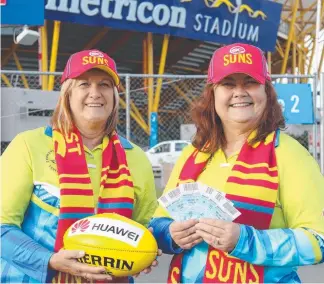  ??  ?? The Suns will thank Commonweal­th Games volunteers such as Jan Hickman (left) and Julie McKenzie with free entry to clash against Geelong at Metricon Stadium on June 2