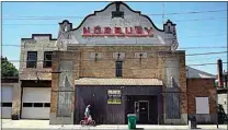  ?? SETH WENIG / AP ?? A man walks past a theater that has been repurposed as a taxi service in Ellenville, N.Y., in Ulster County.