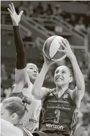  ?? Ross D. Franklin / Associated Press ?? Despite the presence of veteran stars like Diana Taurasi, right, and a variety of young talent, the WNBA is struggling to grow in a crowded sports landscape.