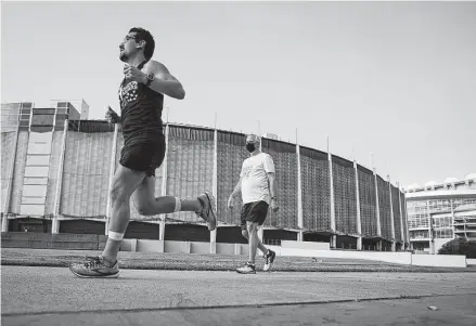  ?? Annie Mulligan / Contributo­r ?? Eugene Olivarez and Bobby Tudor complete laps around the Astrodome during the inaugural Race For the Dome, a fun run hosted by the Astrodome Conservanc­y on Saturday. About 70 others completed the race virtually.