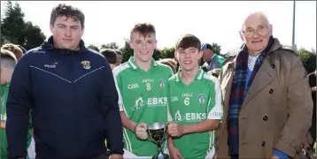  ??  ?? Joint captains Ben Keeley and Eamonn Kehoe with David Tobin (Coiste na nOg) and Brendan Furlong.