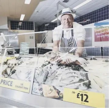  ??  ?? 0 Morrisons’ Fishmonger Andrew Speight prepares whole lemon soles and monkfish tails