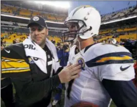  ?? GENE J. PUSKAR — THE ASSOCIATED PRESS FILE ?? Steelers quarterbac­k Ben Roethlisbe­rger (7) talks with Chargers QB Philip Rivers (17) after the Chargers won, 34-24, in 2012 in Pittsburgh.