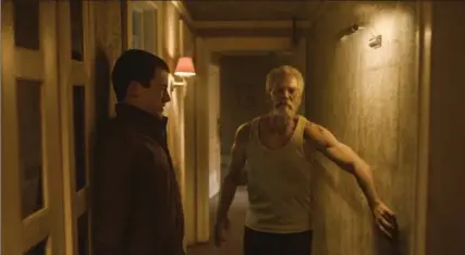  ?? THE ASSOCIATED PRESS ?? Dylan Minnette, left, and Stephen Lang in “Don’t Breathe.” The movie combines thriller with horror and echoes older films in the genre.