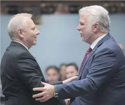  ?? JACQUES BOISSINOT ?? All smiles: Premier Philippe Couillard greets Parti Québécois Leader Jean-François Lisée before question period at the National Assembly in October. These days, Couillard is warning that Lisée and CAQ leader François Legault can’t be trusted.