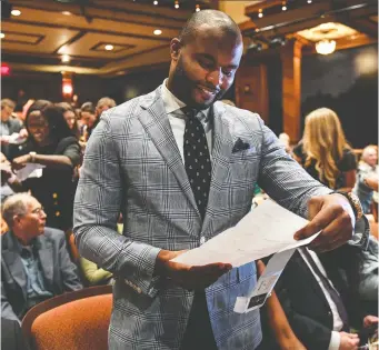  ?? TONI L. SANDYS/THE WASHINGTON POST ?? Former profession­al football player and current neurosurge­on Myron Rolle, pictured in 2017, has volunteere­d for shifts in the COVID-19 surge clinic at Boston’s Massachuse­tts General Hospital. Rolle, just one member of a massive redeployme­nt effort at the hospital, will also pitch in on any floor of the facility that is overwhelme­d.
