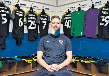  ??  ?? Club colours: Scott Wagstaff shows off his new look after having his beard dyed