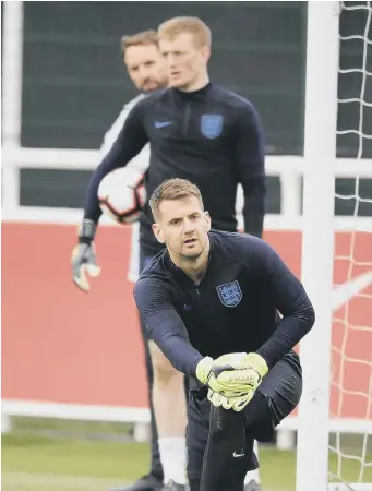  ??  ?? Tom Heaton, in front of Jordan Pickford and England boss Gareth Southgate.
