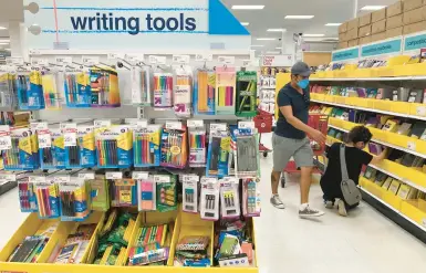  ?? MARTA LAVANDIER/AP ?? With U.S. inflation surging, shoppers seek out bargains on school supplies July 27 at a Target store in South Miami, Fla.