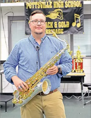  ?? STACI VANDAGRIFF/RIVER VALLEY & OZARK EDITION ?? Devin West, the new director of bands at Pottsville High School, has played saxophone and percussion for years. West, 27, said he was a troubled teenager until his high school band director stepped in. West, who led Gurdon to win the 2A High School Marching Band Competitio­n, said seeing his students realize “that they’re good and they have a future” is, for him, the most rewarding part of teaching.