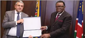  ?? Photo: Emmency Nuukala ?? Awarded… UNWTO secretary general Zurab Pololikash­vili handing over an award to President Hage Geingob yesterday in recognitio­n of his strong commitment to fostering tourism.