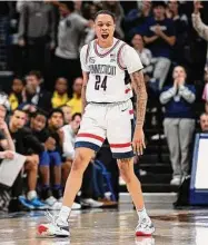  ?? Jessica Hill/Associated Press ?? UConn’s Jordan Hawkins reacts after making a 3-point basket in the second half against Seton Hall on Feb. 18 in Storrs.