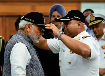  ?? PHOTOGRAPH: narendramo­di / twitter ?? Prime Minister Narendra Modi being felicitate­d by INS Arihant crew