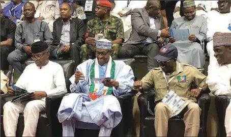  ??  ?? L-R: Vice President Yemi Osinbajo; President Muhammadu Buhari, and Chairman of All Progressiv­es Congress (APC). Adams Oshiomhole, discussing with excitement the new Buhari campaign wristband and leaflets during APC presidenti­al primaries held in Abuja...recently