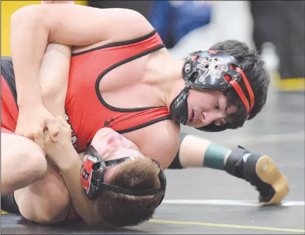  ?? RICK PECK/ SPECIAL TO MCDONALD COUNTY PRESS ?? McDonald County’s Blaine Ortiz pins Eli Stein in the semifinals of the Neosho Wrestling tournament on his way to the finals where he claimed a 10-4 decision over Talan Braswell of Springdale Har-Ber for the title.