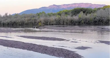  ?? DEAN HANSON/JOURNAL ?? Sandbars are evident at the Rio Grande north of the Alameda Bridge in Albuquerqu­e on Wednesday. Officials say there should be enough water to keep the river running through the end of October.