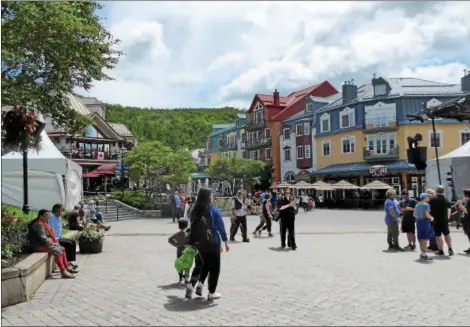  ?? JANET PODOLAK — THE NEWS-HERALD ?? The pedestrian village of Mont Tremblant is packed with dining, drinking and entertainm­ent options.