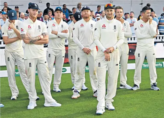  ??  ?? Reasons to be cheerful: Joe Root and England reflect on winning the final Test (left) while Australia celebrate retaining the urn (far left)