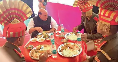  ?? PTI ?? Union Home Minister Rajnath Singh having lunch with jawans in Pelling, Sikkim, on Sunday. —